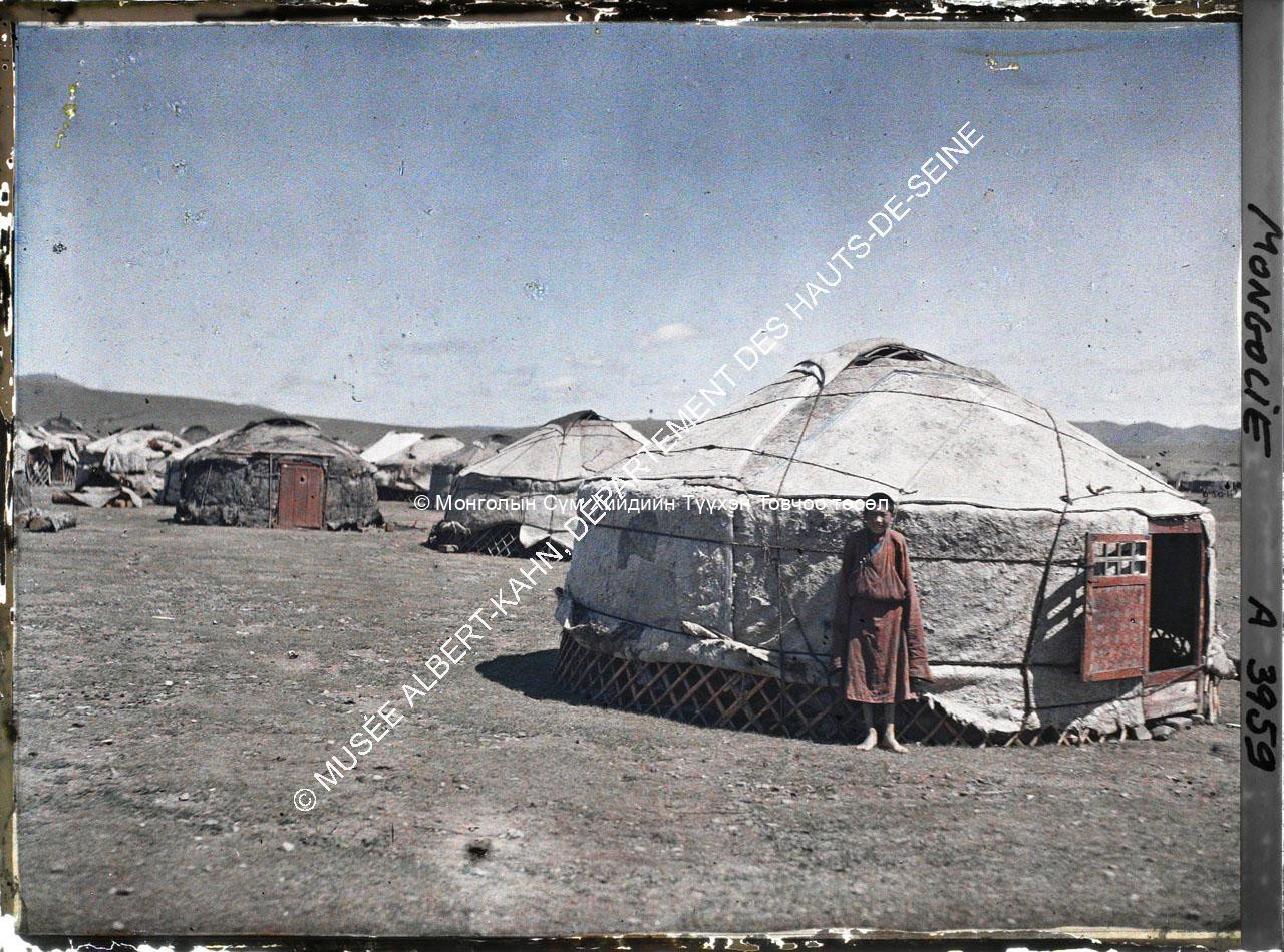 A monk child in front of a yurt behind Gandan (?). Musée Albert-Kahn. A 3959.  Photo by Stéphane Passet, 20 July 1913